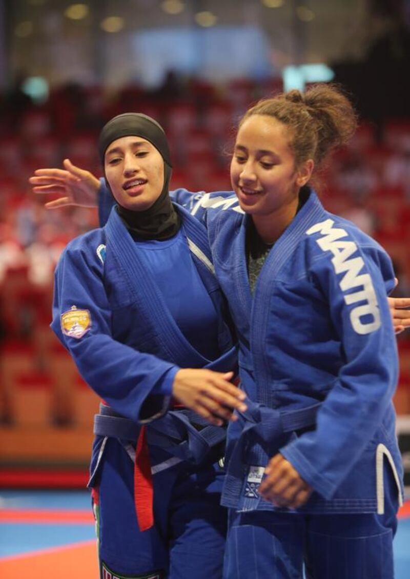 Maha Al Hinaai of the UAE, left, congratulates Maitha Abdulla Abdulla of the UAE in the Abu Dhabi World Youth Jiu-Jitsu Championship 2016. Ravindranath / The National