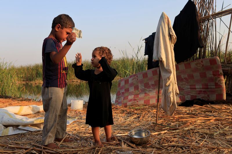 Children play at the Chebayesh marsh.
