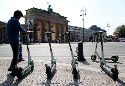 E-scooters of California-based bicycle service Lime are pictured by the Brandenburg Gate in Berlin, Germany, August 8, 2019. REUTERS/Fabrizio Bensch