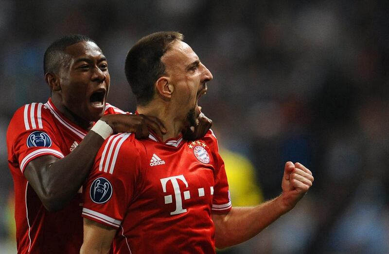 Bayern Munich’s Franck Ribery, right, celebrates with his teammate David Alaba after scoring the opening goal during their win over Manchester City in a Uefa Champions League match on Wednesday. Andreas Gebert / EPA