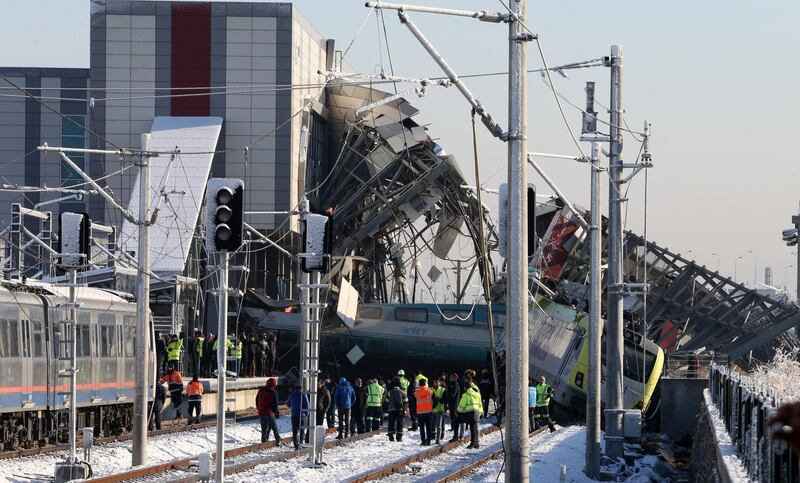 Firefighters and medics try to rescue victims after a high speed train accident in Ankara, Turkey. EPA