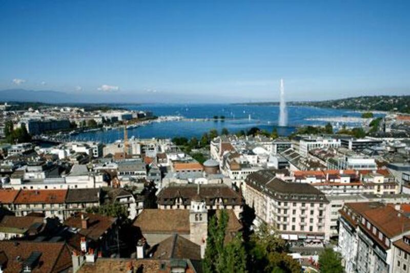 A view across the city of the famous jet d’eau, or water fountain, and Lac Léman, seen from the cathedral of St Peter.