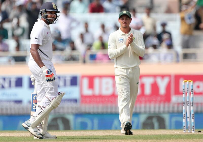 South Africa's Quinton de Kock applauds Rohit Sharma, left, on scoring a double century. AP