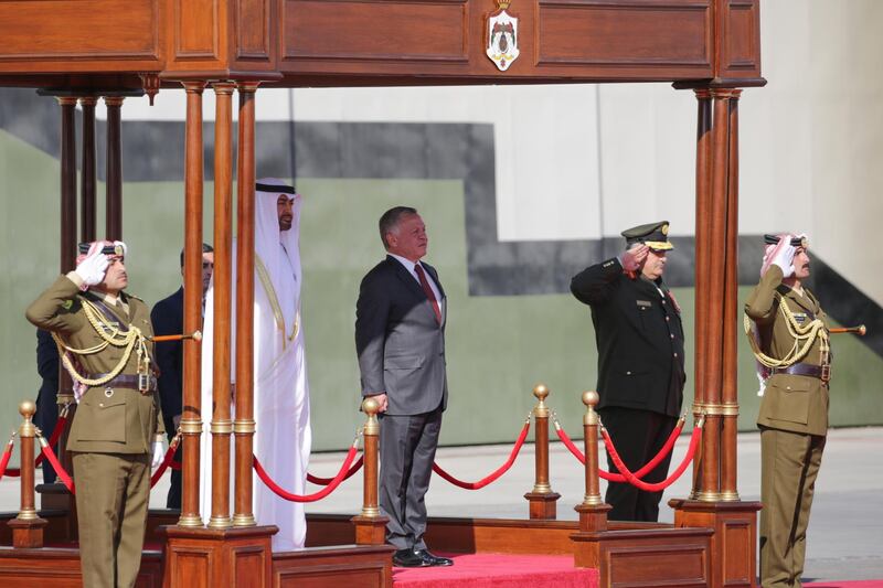 Sheikh Mohamed bin Zayed and King Abdullah listen to the national anthems before inspecting the Royal Guard of Honour. Andre Pain / EPA