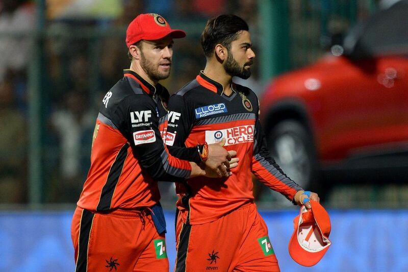 Virat Kohli, right, and AB De Villiers. AFP / MANJUNATH KIRAN