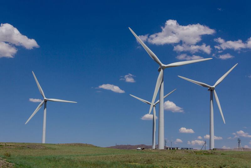 A group of wind generators in the steppes of Kazakhstan. Abu Dhabi's ADQ and Taqa have agreed with Kazakhstan's Samruk-Kazyna to explore the development of three greenfield power projects in the country. Photo: Alamy