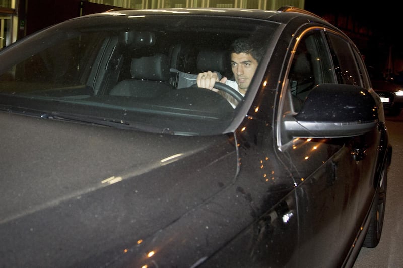 BARCELONA, SPAIN - MAY 17: Barcelona's Luis Suarez drives his car as supporters of FC Barcelona celebrate championship victory to welcome Barcelona team members at the FC Barcelona's Sports Center "Joan Gamper" at Sant Joan DespÃ­, near Barcelona after the La Liga match between Club Atletico de Madrid and FC Barcelona, on May 17, 2015 in Barcelona, Spain. (Photo by Joan Alvado/Anadolu Agency/Getty Images)