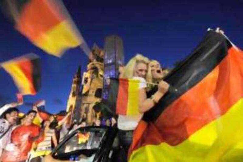 Supporters of the German football team celebrate after the Group B Euro 2008 football match between Austria and Germany on June 16, 2008 in Berlin. Germany won the match 0-1 and will play against Portugal in the quarter-finals.AFP PHOTO / DDP - MICHAEL KAPPELER