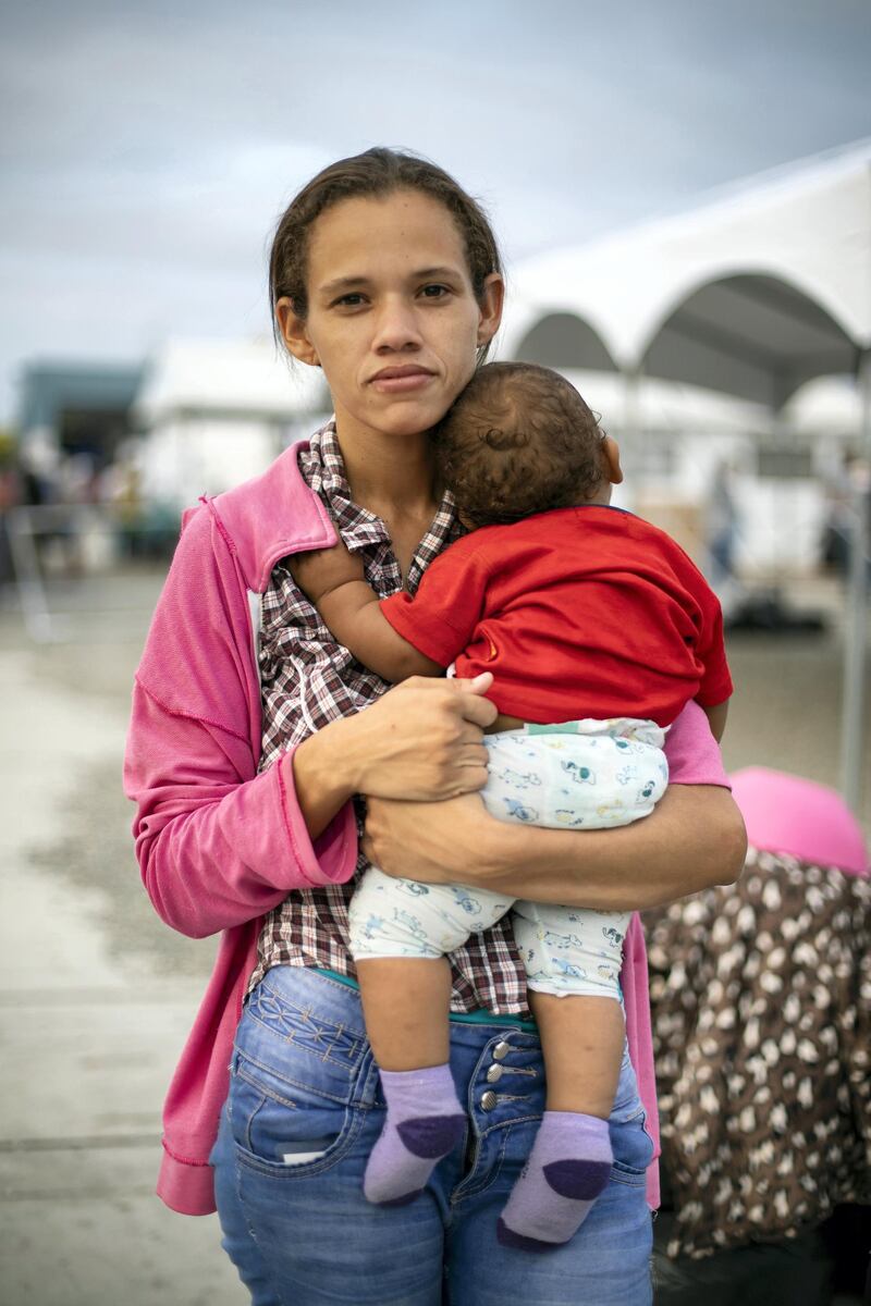 STRICTLY NO USE BEFORE 05:00 GMT (09:00 UAE) 18 JUNE 2020

“I arrived today at the border with my husband and two children," says Daniela, 29, with her 10-month-old baby at the Ecuador-Peru border. "We left Venezuela five days ago by bus. My husband is checking now how to get the entry stamp on our passports. I wanted to cross the border before 15 June, when the humanitarian visa will become mandatory. We don’t really know what will happen after that. We want to go to Lima where we can stay with friends. It is impossible to remain in Venezuela, there is no medicine, little food, and everything is so expensive." ; On 7 June 2019, Peru announced new visa requirements for Venezuelans, starting on Saturday 15 June. Rushing to beat the deadline, on 14 June some 8,112 Venezuelans crossed the border at Tumbes, the largest number ever recorded in a single day. Of them, 4,700 lodged asylum claims in Peru, also an unprecedented number. In total, Peru received over 227,000 asylum applications by Venezuelan citizens. Temporary residence permits were awarded to over 383,000. An estimated 768,000 Venezuelan refugees and migrants were in Peru – out of more than the four million living in exile, mainly in Colombia, Ecuador, Peru and Brazil.
