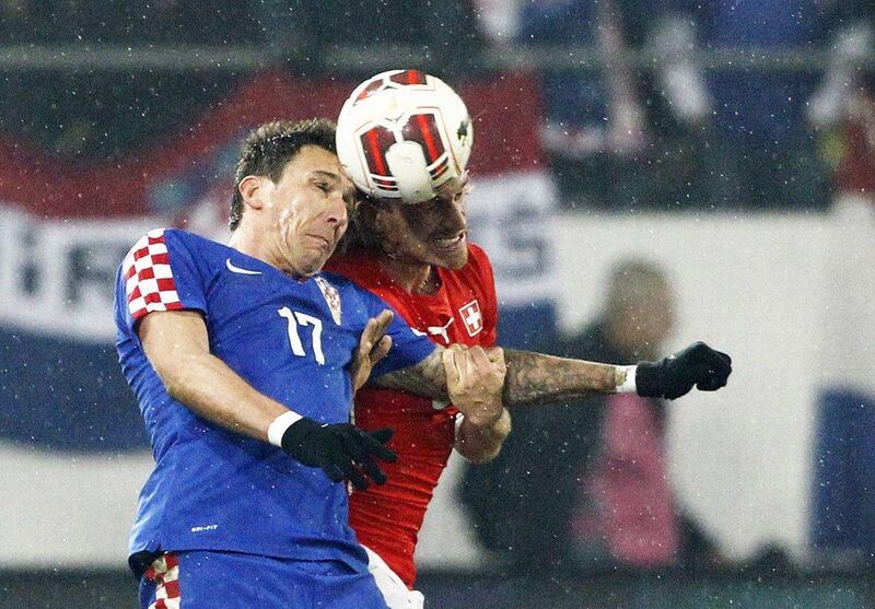 Mario Mandzukic and Croatia drew Switzerland 2-2. They'll play in Group A at the 2014 World Cup with Brazil, Mexico and Cameroon. Michael Buholzer / AFP