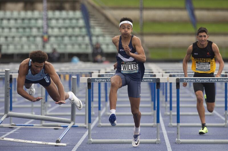 Tayleb Willis, centre, wins the U17's 110m men's final during the Australian Track and Field Championships in Sydney, Australia. EPA