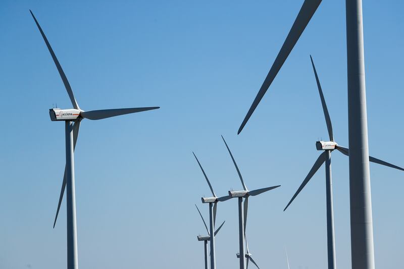 Wind turbines are seen at an Acciona Energia wind park in Puebla de Almenara, Spain. Wind and solar power capacity grew by 238 gigawatts globally in 2020. Reuters