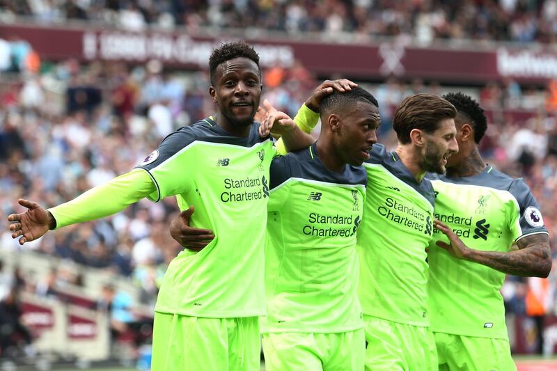 STRATFORD, ENGLAND - MAY 14: Divock Origi of Liverpool celebrates scoring his sides fourth goal with Daniel Sturridge of Liverpool and Adam Lallana of Liverpool during the Premier League match between West Ham United and Liverpool at London Stadium on May 14, 2017 in Stratford, England.  (Photo by Jan Kruger/Getty Images)