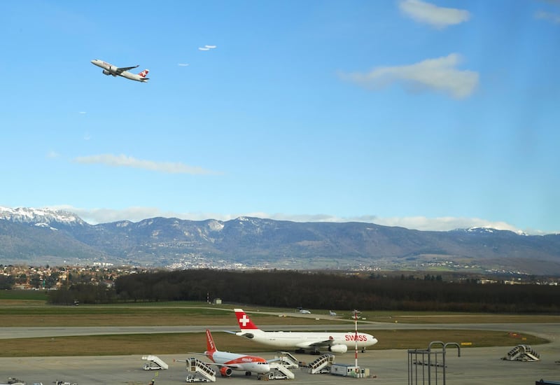 FILE PHOTO: A Swiss airline aircraft takes off at Cointrin Airport during the outbreak of the coronavirus disease (COVID-19) in Geneva, Switzerland, March 13, 2020. Picture taken through a window. REUTERS/Denis Balibouse/File Photo