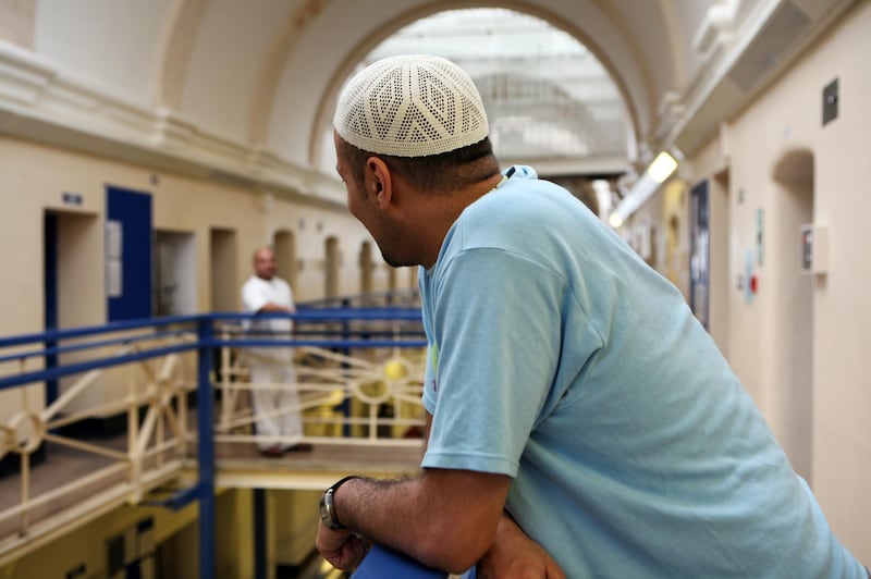 A Muslim inmate on the balcony outside his cell in Wandsworth prison.
HMP Wandsworth in South West London was built in 1851 and is one of the largest prisons in Western Europe. It has a capacity of 1456 prisoners.