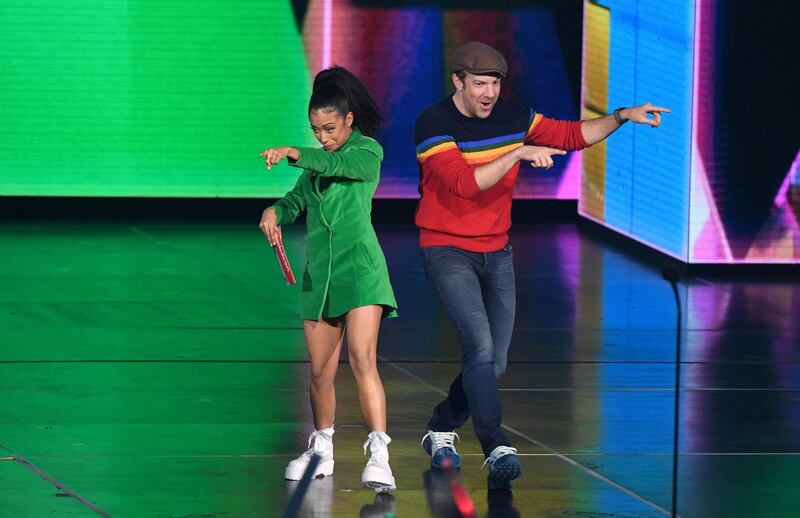 Liza Koshy and actor Jason Sudeikis present on stage.  AFP