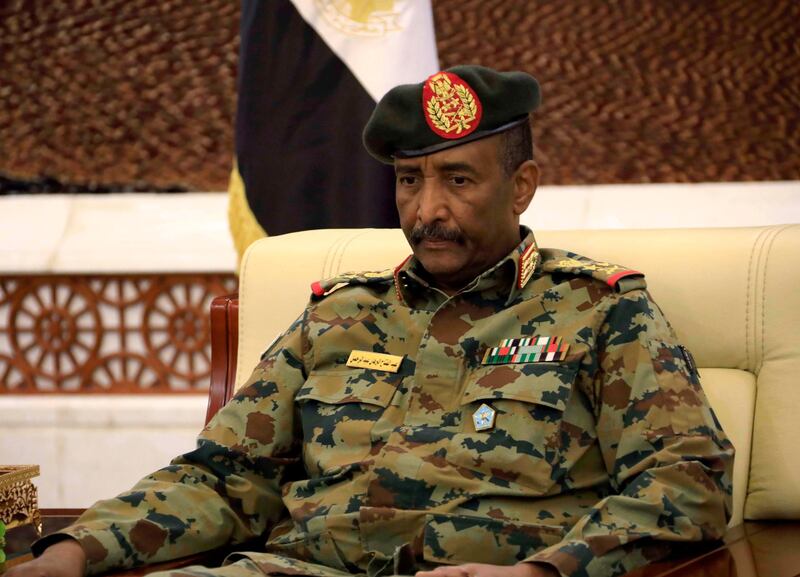 epa07783657 Leader of Sudan's transitional council, Lieutenant General Abdel Fattah Abdelrahman Burhan looks on after  being sworn in as the Head of the newly formed transitional Council at the presidential palace in Khartoum, Sudan, 21 August 2019. The Sudanese opposition and military council signed on 17 August a power sharing agreement. The agreement sets up a sovereign council made of five generals and six civilians, to rule the country until general elections. Protests had erupted in Sudan at the end of 2018, culminating in a long sit-in outside the army headquarters which ended with more than one hundred people being killed and others injured. Sudanese President Omar Hassan al-Bashir stepped down on 11 April 2019  EPA/STRINGER