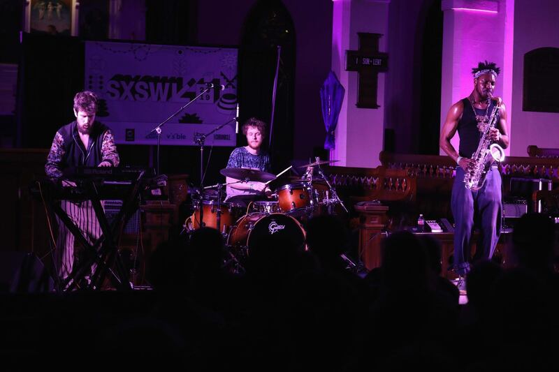 AUSTIN, TX - MARCH 13:  (L-R)  Danalogue The Conqueror, Betamax Killer, and Shabaka Hutchings of The Comet is Coming perform onstage at Verve Music Group during the 2019 SXSW Conference and Festivals at Bethel Hall at St. David's Church on March 13, 2019 in Austin, Texa  (Photo by Diego Donamaria/Getty Images for SXSW)