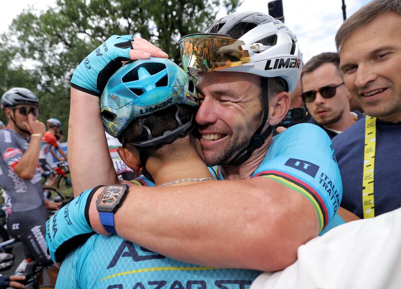 Mark Cavendish celebrates with a Astana Qazaqstan teammate after winning Stage 5 from Saint-Jean-de-Maurienne to Saint Vulbas. EPA