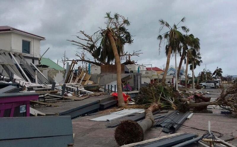 Damaged buildings and fallen trees litter downtown Marigot, on the island of St. Martin, after the passing of Hurricane Irma, Saturday, Sept. 9, 2017.  On the Dutch side of St. Martin, an island divided between French and Dutch control, an estimated 70 percent of the homes were destroyed by Irma, according to the Dutch government. The island is divided between French Saint-Martin and Dutch Sint Maarten. (AP Photo/Amandine Ascensio)