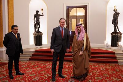 UK Foreign Secretary David Cameron with his Saudi counterpart Prince Faisal bin Farhan, as he welcomes Arab and Islamic officials to Lancaster House, London. PA