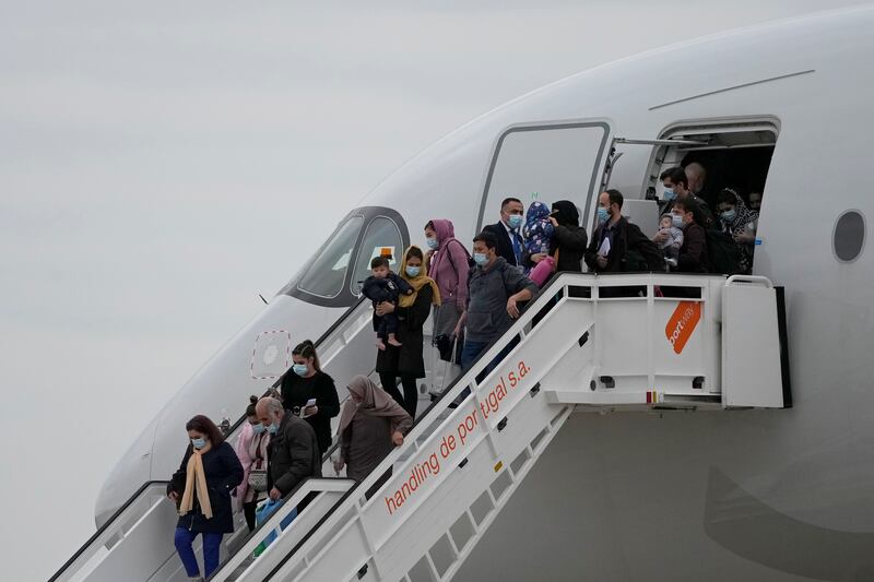 Some of the young musicians left the commercial charter flight clutching new instruments, from drums to violins. AP Photo