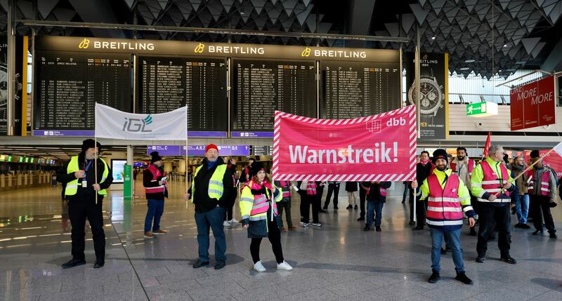 Workers picket the terminal hall at Frankfurt airport during a nationwide transport strike. EPA