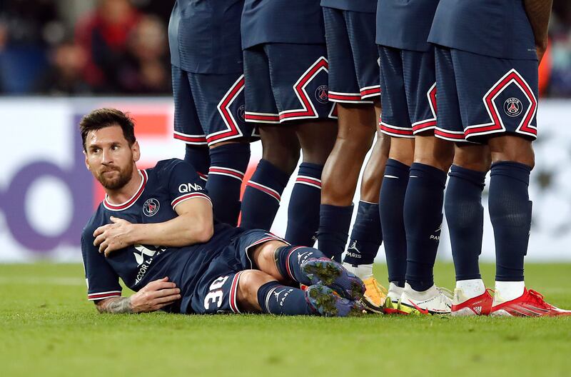 Paris Saint-Germain's Lionel Messi lies on the pitch to defend a free-kick during the Champions League match with Manchester City at  Parc des Princes on September 28. Reuters