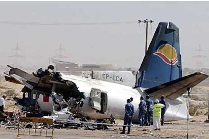 Iranian and Emirati experts inspecting the plane that crashed in Sharjah, killing 43 people on board.