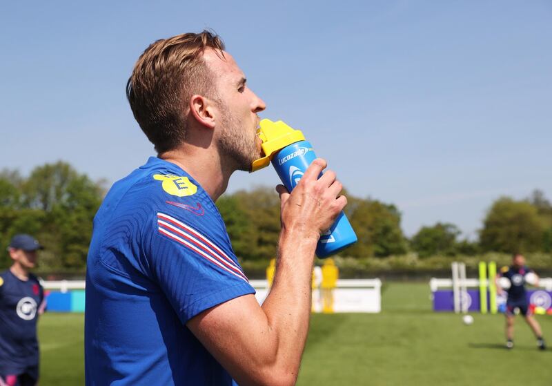 MIDDLESBROUGH, ENGLAND - JUNE 01: Harry Kane of England takes a drink from a Lucozade bottle during a training session at an England Pre-Euro 2020 Training Camp on June 01, 2021 in Middlesbrough, England. (Photo by Eddie Keogh - The FA/The FA via Getty Images)