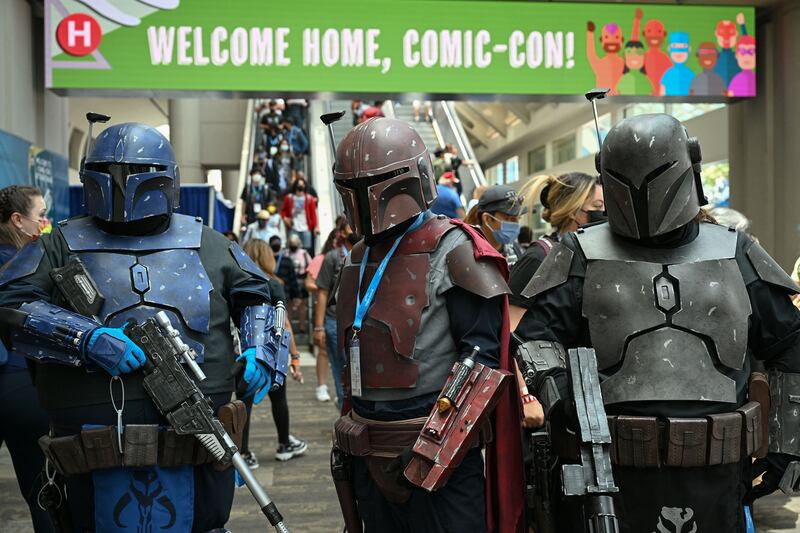 Mandalorian cosplayers pose in the convention centre. AFP