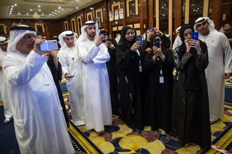 Candidates wait for the announcement of the fourth session of Federal National Council elections at a polling station in Dubai, UAE.  EPA