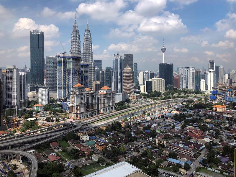 This May 25, 2018, photo show a general view of capital city of Kuala Lumpur, Malaysia. Malaysia's new Prime Minister Mahathir Mohamad said Wednesday, May 30, 2018, the government will set up a trust fund to let the public contribute to easing the country's huge national debt. (AP Photo/Vincent Thian)