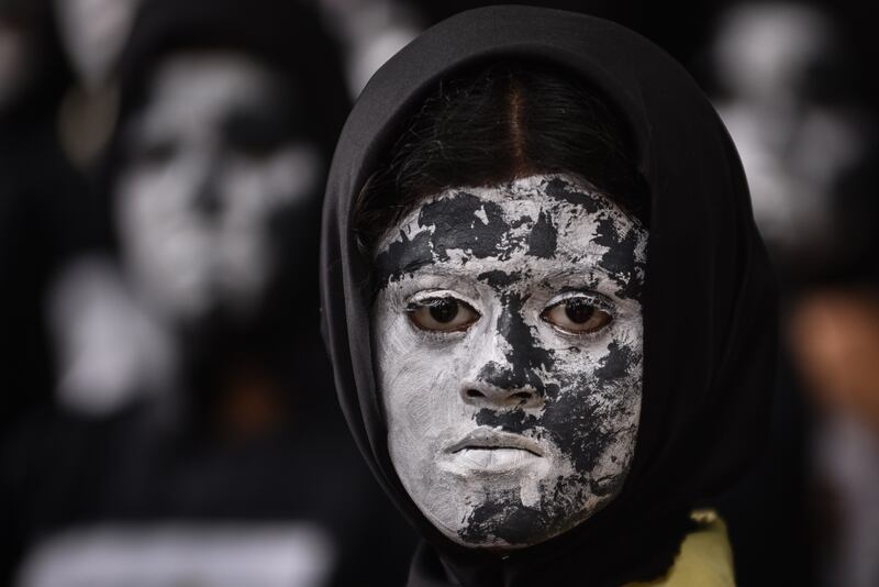 The students faces were painted to resemble the Moon. EPA