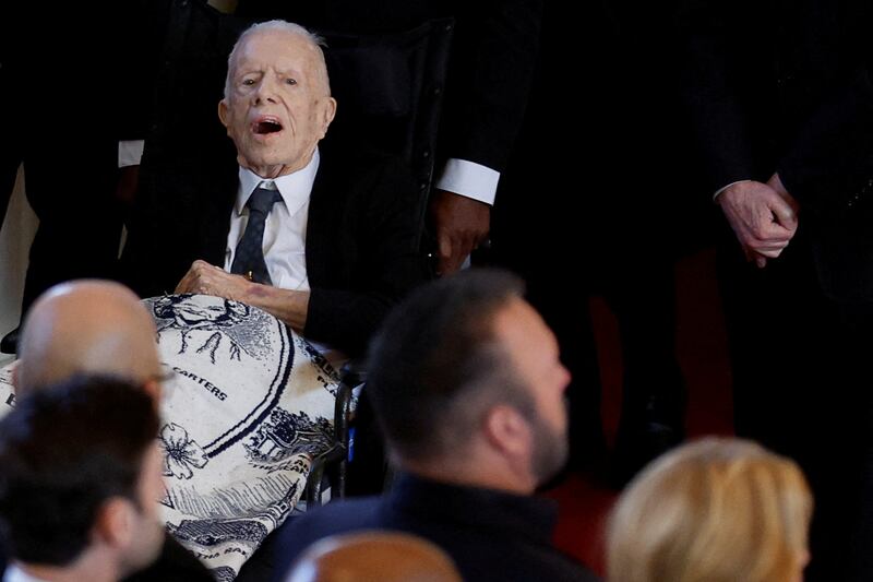 Former US president Jimmy Carter attends the service for his wife. Reuters