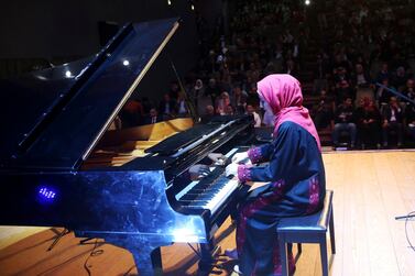 Palestinian musician Yara Thabit plays Gaza’s grand piano in a concert last year. AP