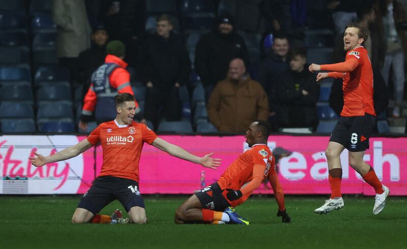 Luton Town's Reece Burke celebrates scoring their first goal against Chelsea. Reuters