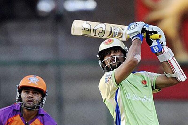 Kochi Tuskers Kerala wicketkeeper Parthiv Patel could only watch as Tillakaratne Dilshan and Chris Gayle conquered the target with ease.