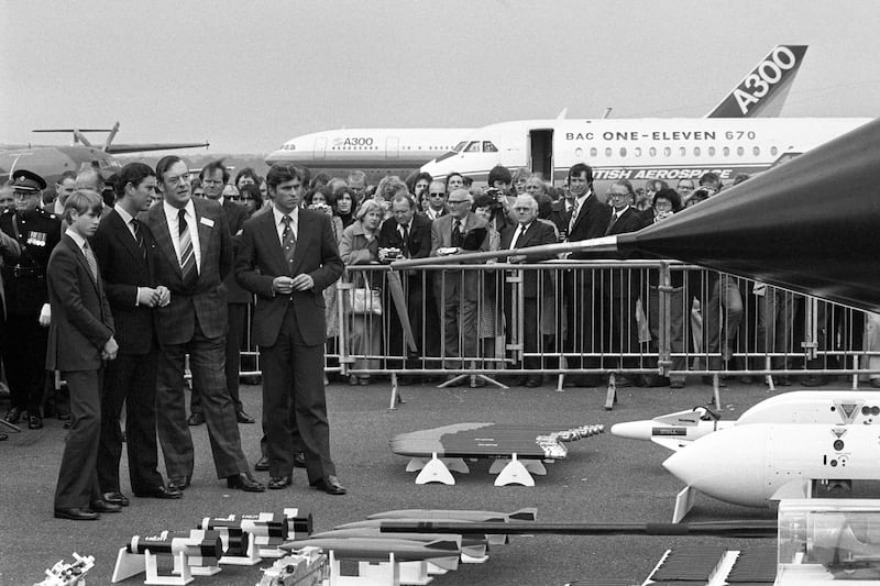 Prince Charles, with his brothers Prince Andrew and Prince Edward, inspect the Tornado multi-role combat aircraft and its payload at Farnborough Airshow in 1978.