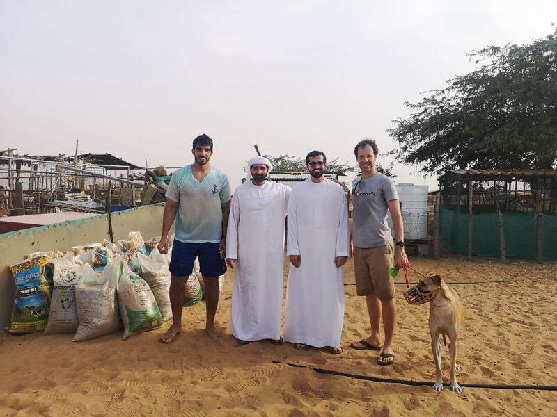 Mr Murphy with fellow rescuers who joined him in his efforts to free the camel that had become trapped in quicksand.