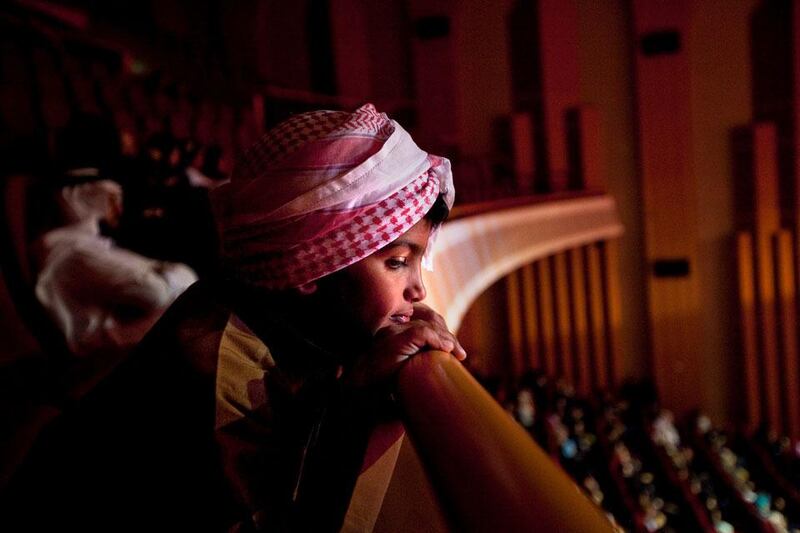 Audience members silently tune in as they listen to the performances  during the Millions Poet competition at the Al Raha Theatre near Abu Dhabi.  Silvia Razgova / The National