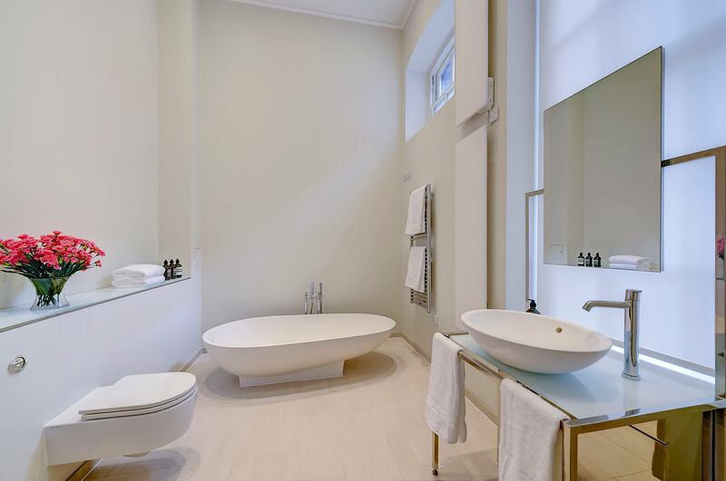 The en-suite bathroom with a bath and separate shower