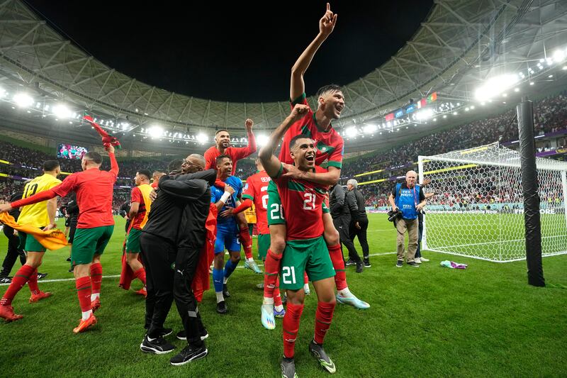 Morocco's players celebrate after winning their World Cup quarter-final against Portugal in Qatar in December 2022. AP
