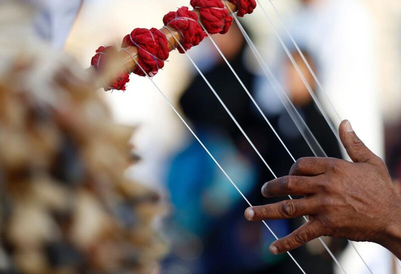Emiratis play traditional music.