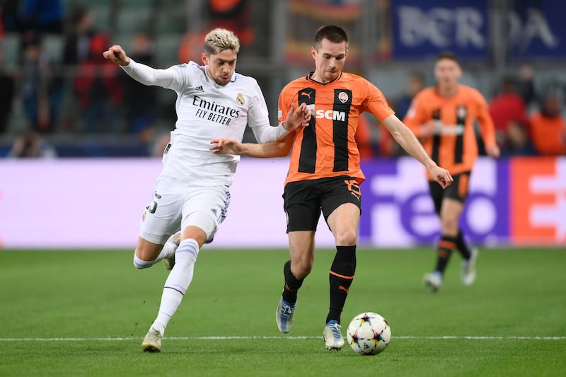 Bohdan Mykhailichenko of Shakhtar Donetsk is challenged by Federico Valverde of Real Madrid. Getty