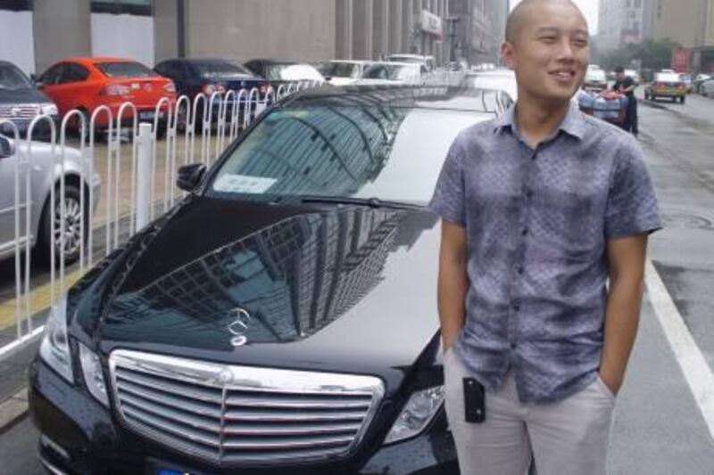 Feng Yao with his E-Class Mercedes.

Credit: Daniel Bardsley/The National