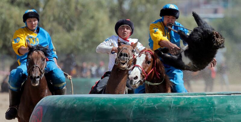 Kazakh and Russian horsemen take part in kok-boru. EPA