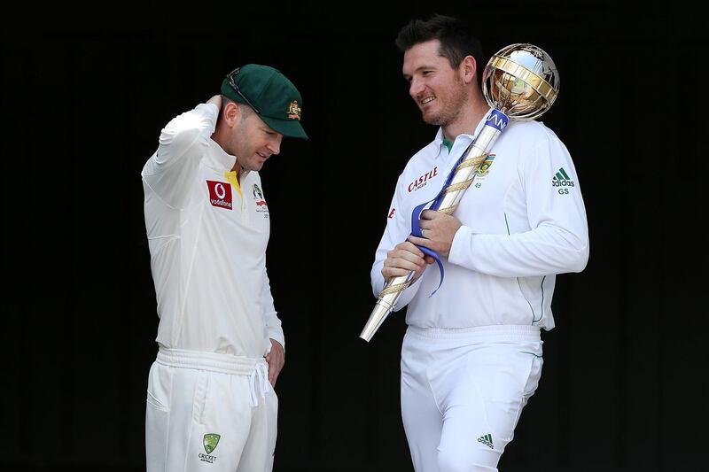BRISBANE, AUSTRALIA - NOVEMBER 08:  Michael Clarke of Australia and Graeme Smith of South Africa pose with the ICC Test Championship Mace during a captain's media call at The Gabba on November 8, 2012 in Brisbane, Australia.  (Photo by Chris Hyde/Getty Images)