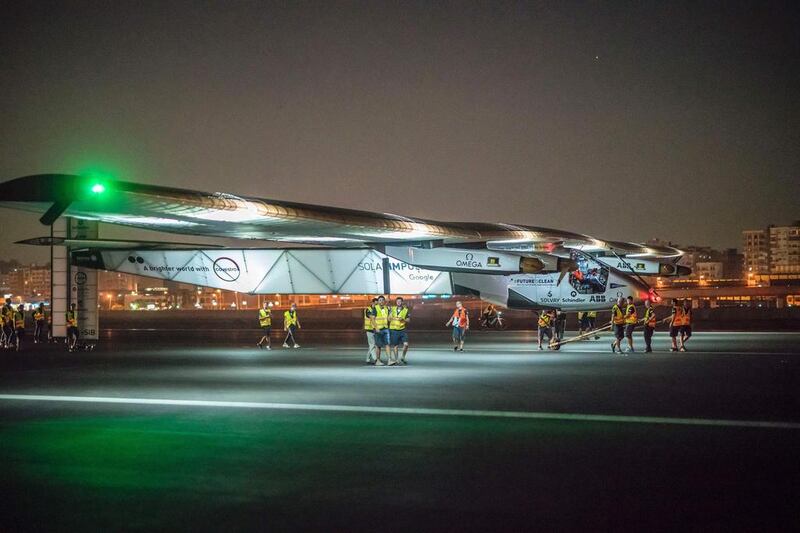 Solar Impulse 2 technicians prepare the plane for flight at Cairo with Bertrand Piccard at the controls. Jean Revillard / AFP