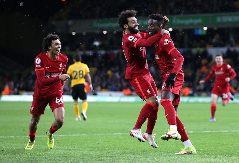 Liverpool's Divock Origi, right, celebrates with Mohamed Salah after scoring. PA